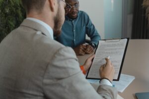 Business leader reviewing hiring decisions before writing an offshore job description